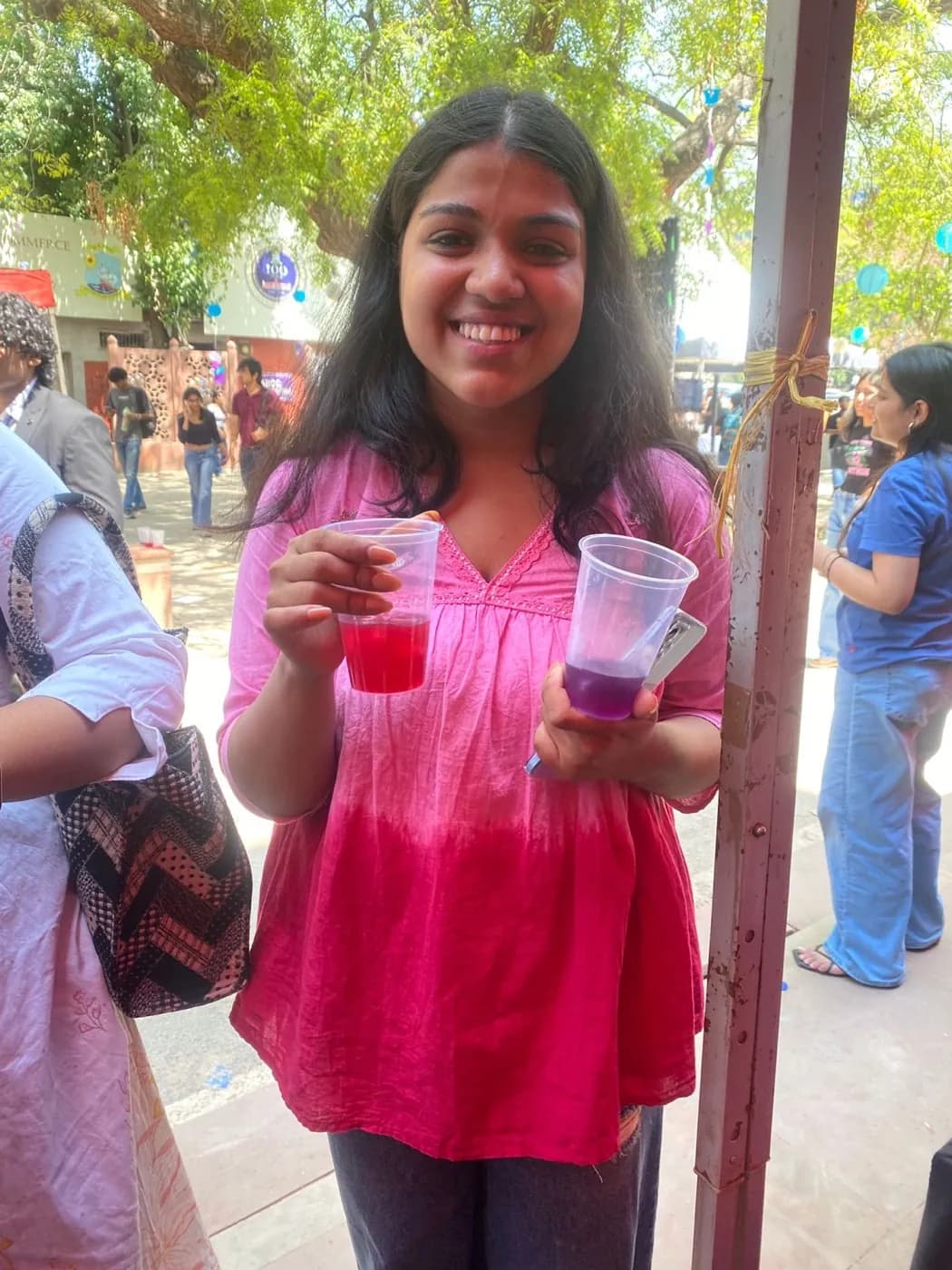 A happy guest holding two Brewtales teas